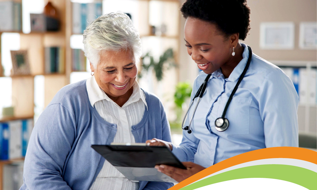 A doctor looking at a clipboard with a patient