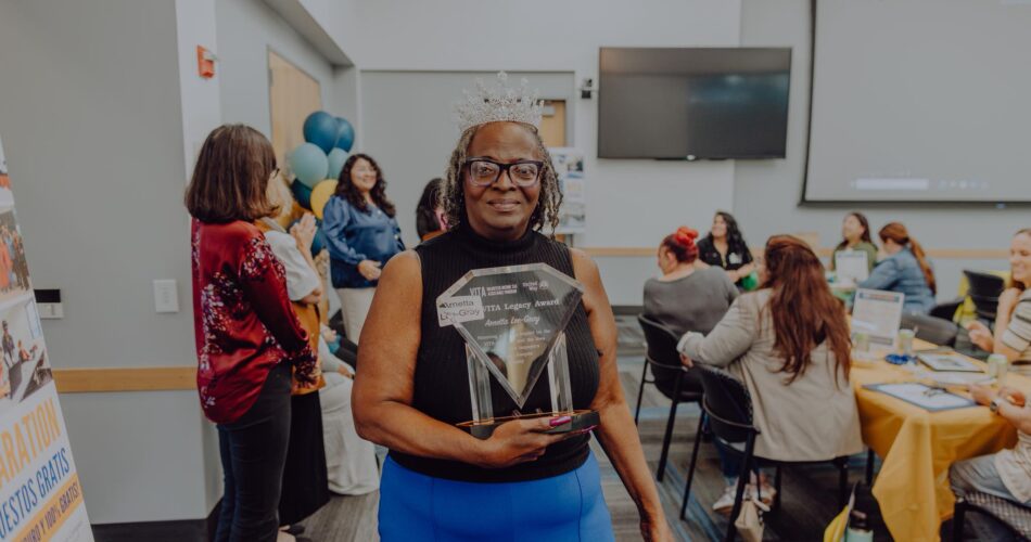 Arnetta Gray receiving the VITA legacy award at the Health Plan of San Joaquin Headquarters.