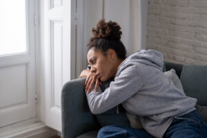Sad black woman suffering from depression symptoms feeling distr A woman showing symptoms of depression.
